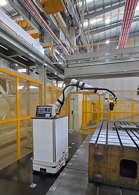 Mobile manipulator inspecting a die at the real factory