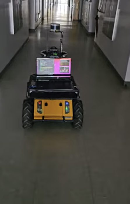 Husky A200 driving autonomously along a corridor